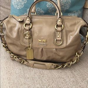 Coach purse packets inside gold color green inside